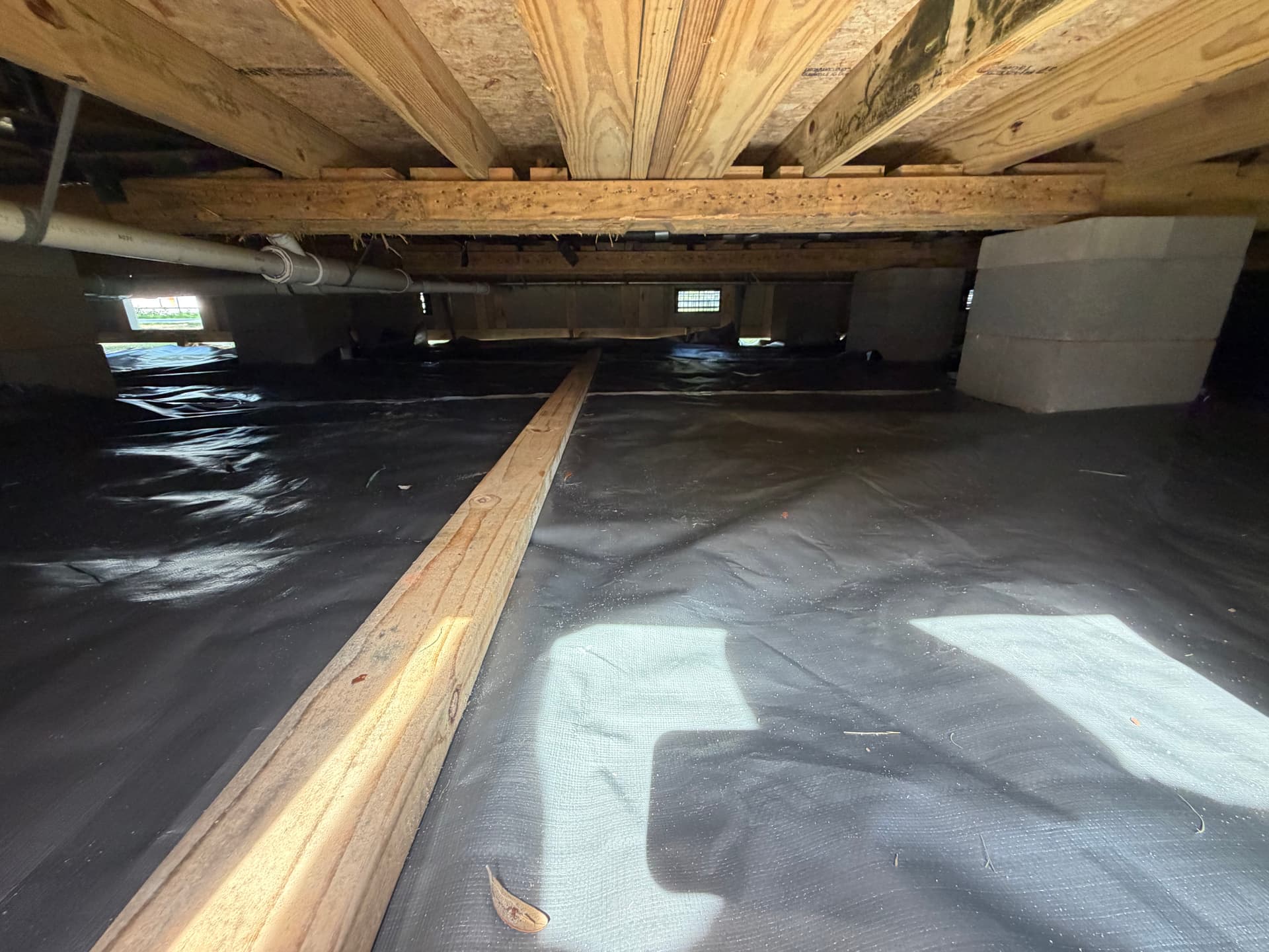 Gallery photos for Tiny Home Crawl Space Vapor Barrier Install in Pensacola: Image #1